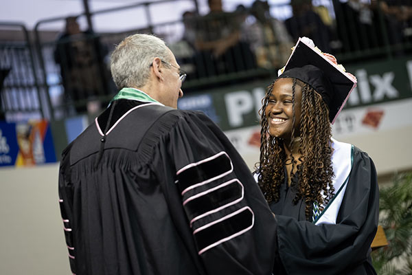 Rising Phoenix student graduates.