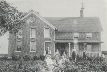 Black and white photograph of a farmhouse