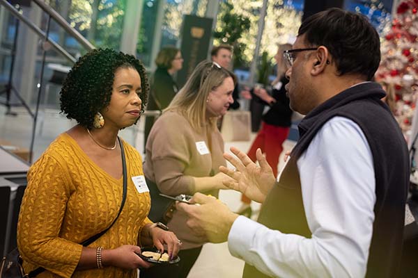 woman talking with man at event