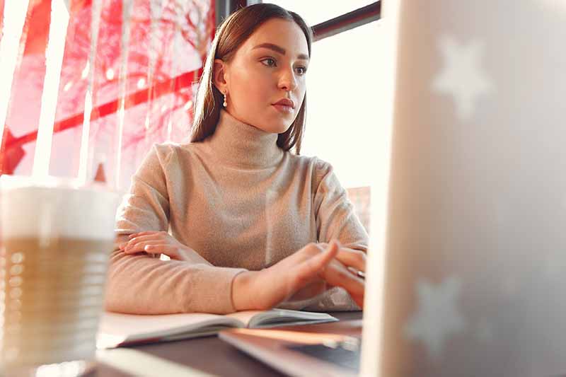 woman student working on laptop