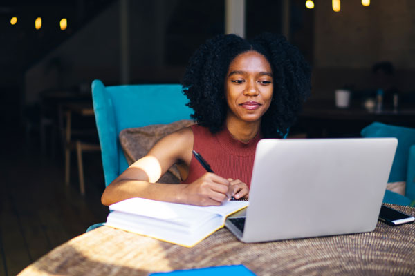 Female student studying at laptop