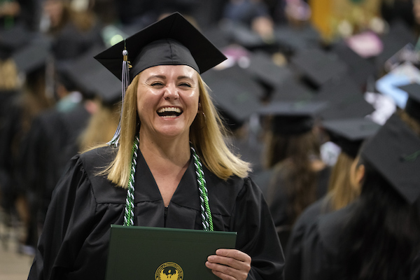Smiling graduate at commencement