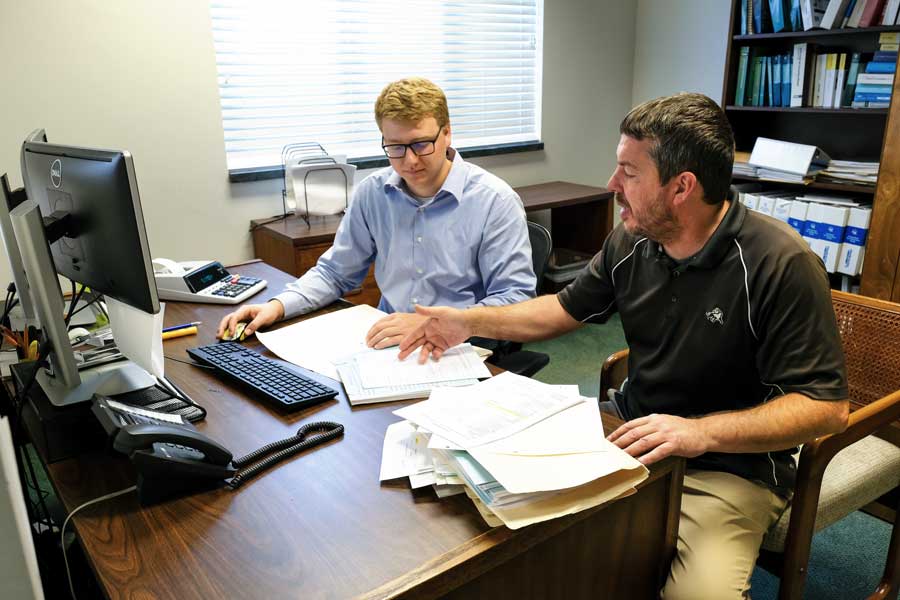 Student intern works with works with company employee