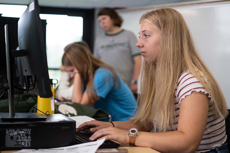 Mishicot student working on computer