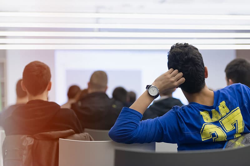 students listening to class presentation