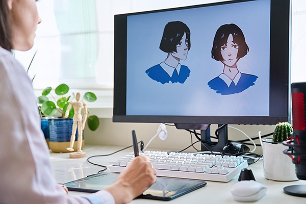 Person creating illustrations on a computer