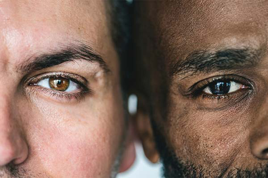 Closeup of eyes of two different ethnic men