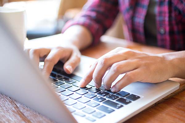 closeup of student typing