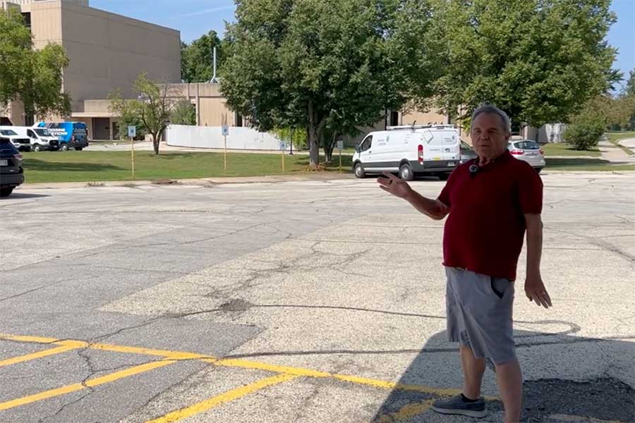 Man giving directions to the LLI Office.