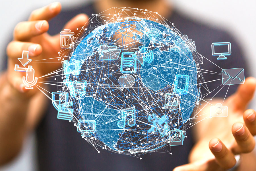 Hands holding digital rendition of globe and system data