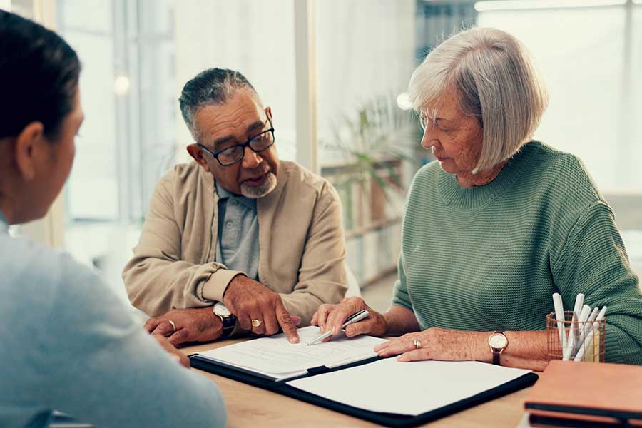 Group of people reviewing documents.