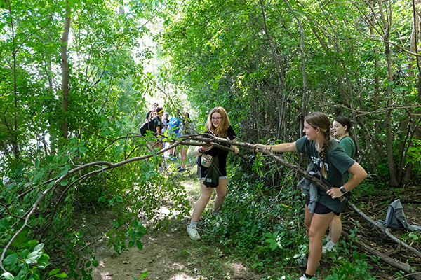 Students cleaning up a trail