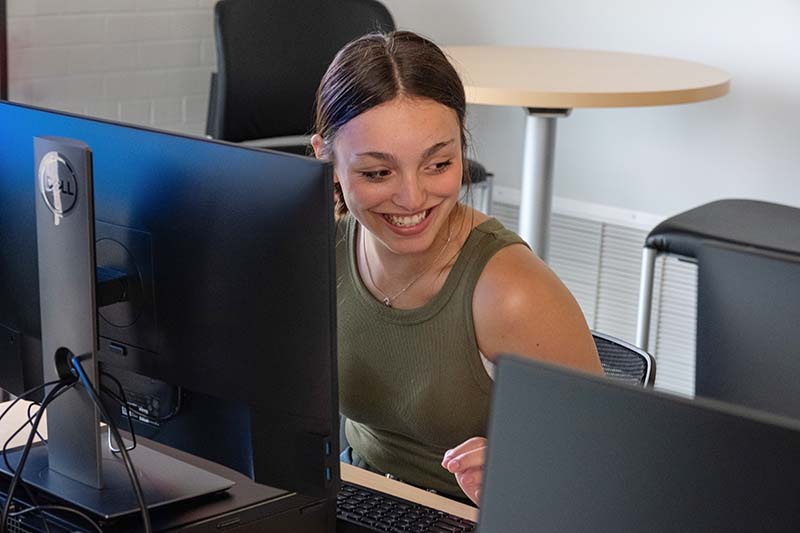 student sitting at computer during orientation