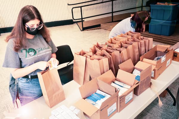 Community Health worker assembles health kits