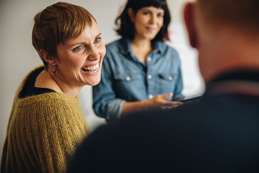 woman smiling during a meeting