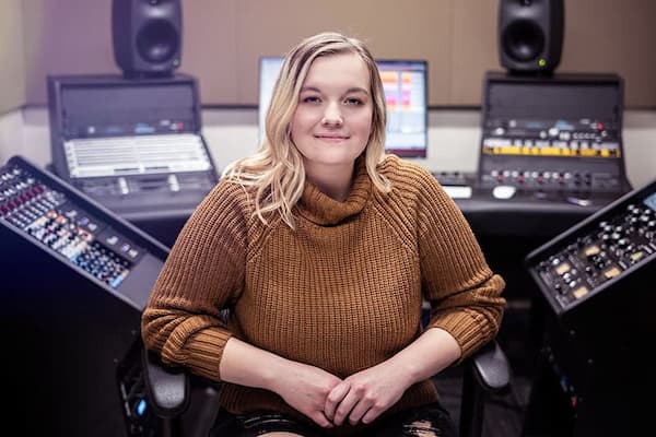 Confident student in recording studio