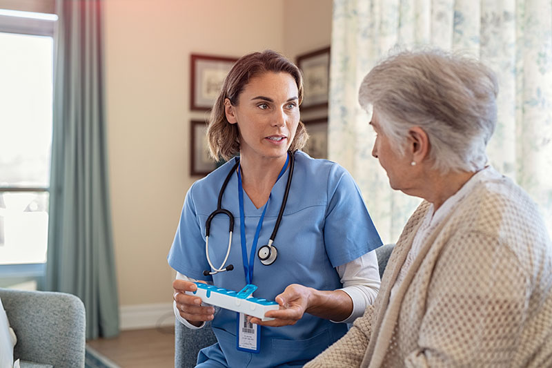 Nurse explaining medications to patient