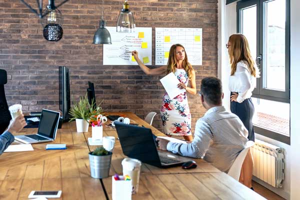 Coworkers gather to go over business idea