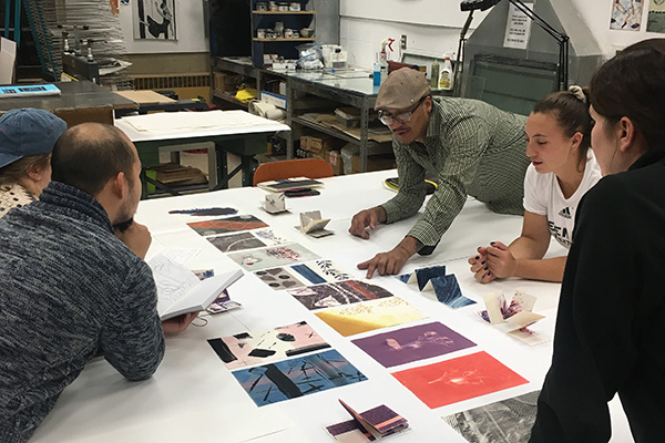 Students having an art critique in studio
