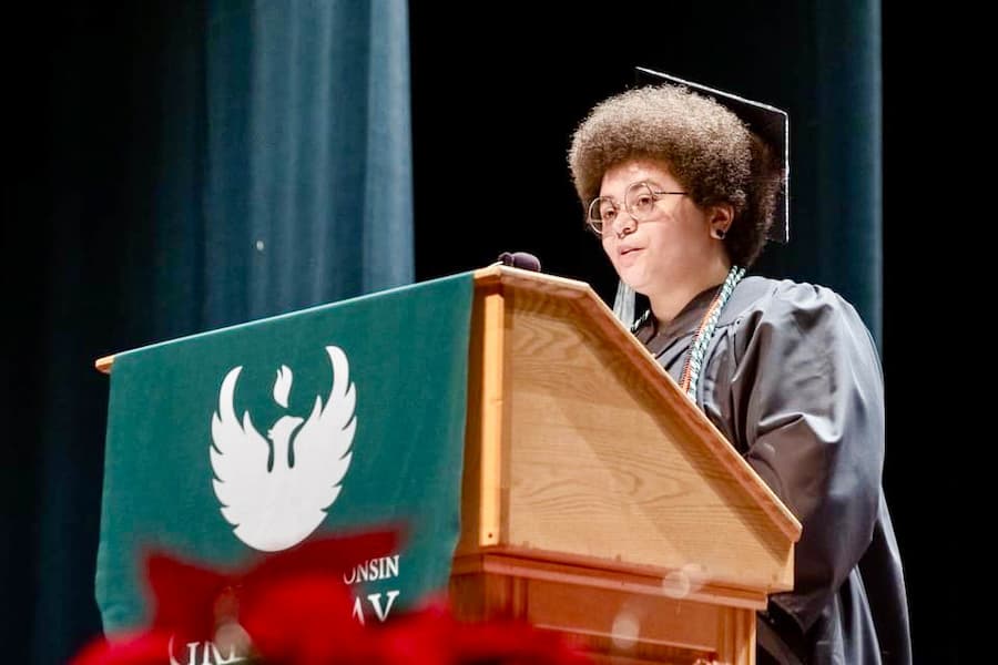 Writing and applied arts graduate, Kimberly Davis, gives speech at commencement ceremony
