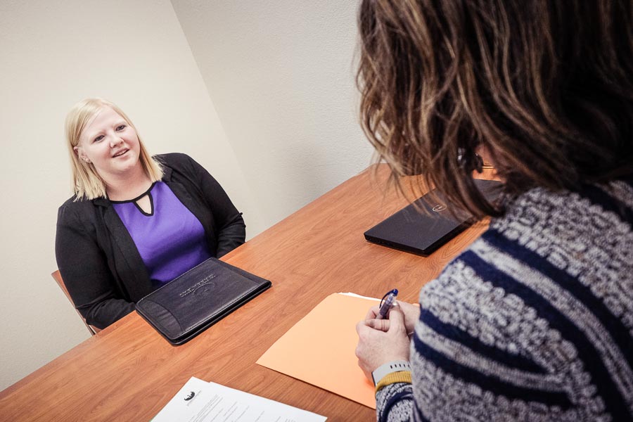 Candidate and hiring manager meet at an interview