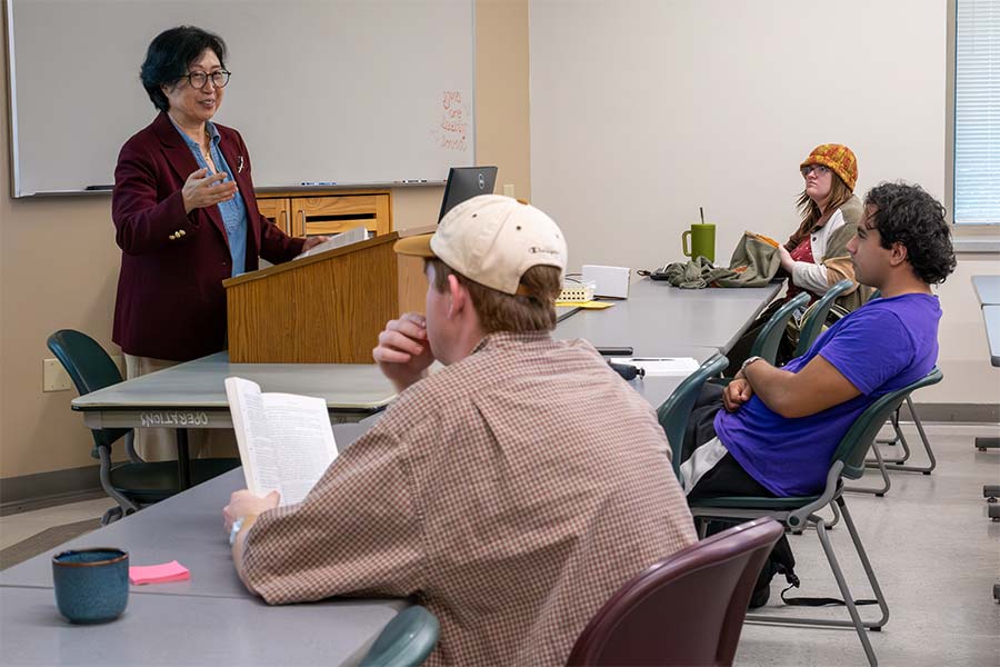 Professor Hyekyung Kim leads discussion in Plato and Aristotle class