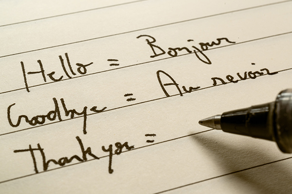 Handwritten French translations in a notebook