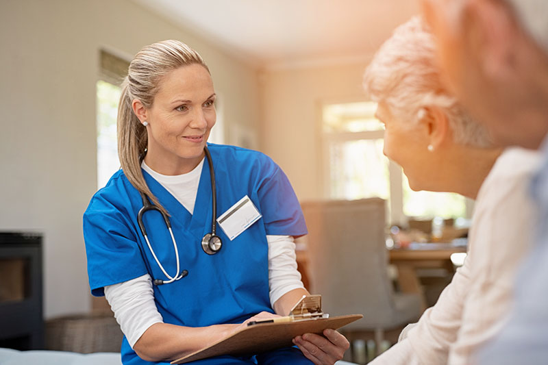 nurse talking to seniors