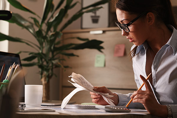 woman looking at receipts