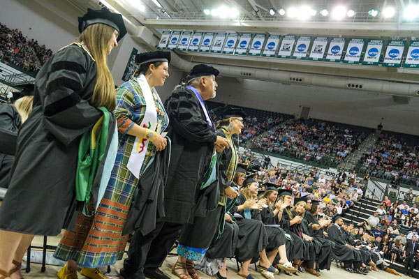 First Nations students and professors at commencement