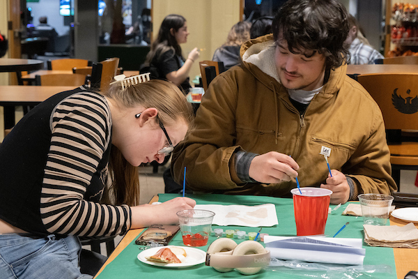 Students participating in Paint n' Sip event on campus
