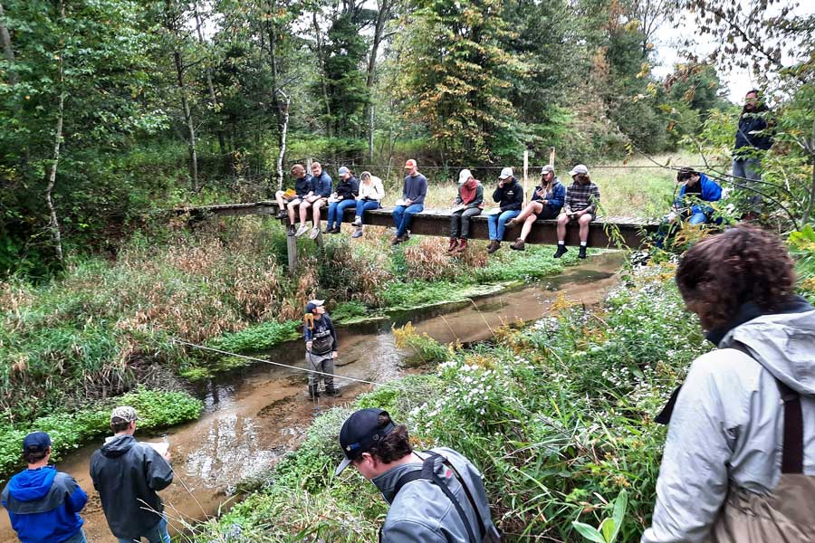 Group of students perform water research