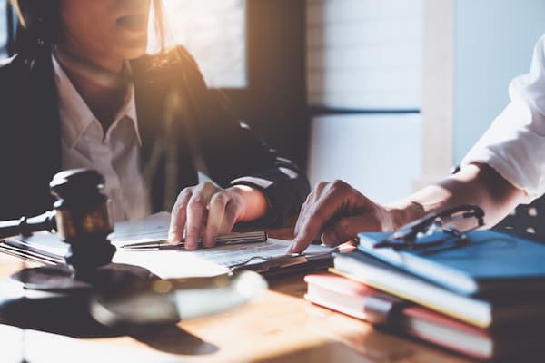 Two legal professionals meet in a law office