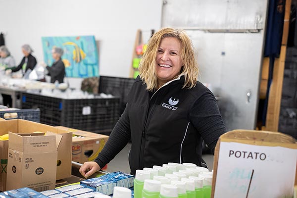 Sandi Maine volunteering at Paul's Pantry for UWGB Day of Service