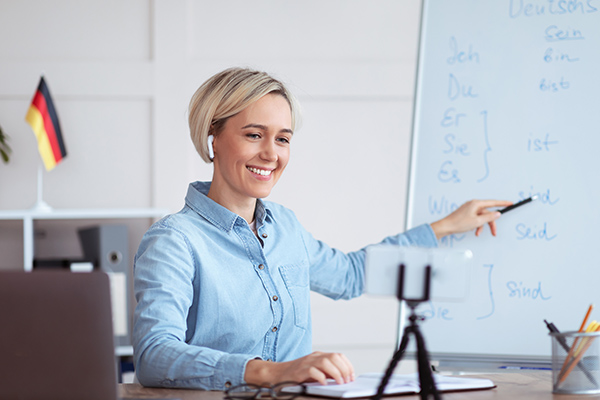 woman working online with German flag in background