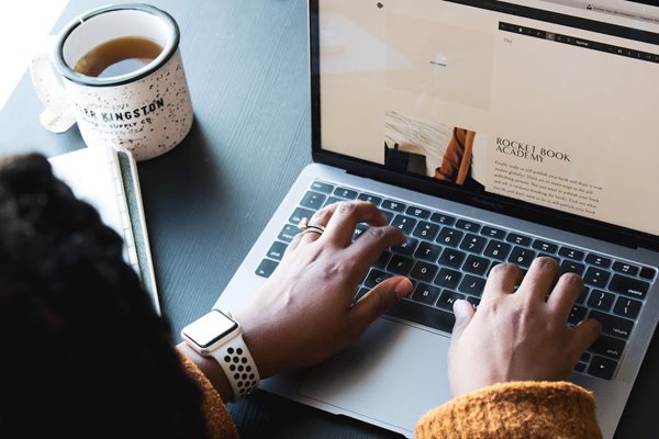 Person typing on computer