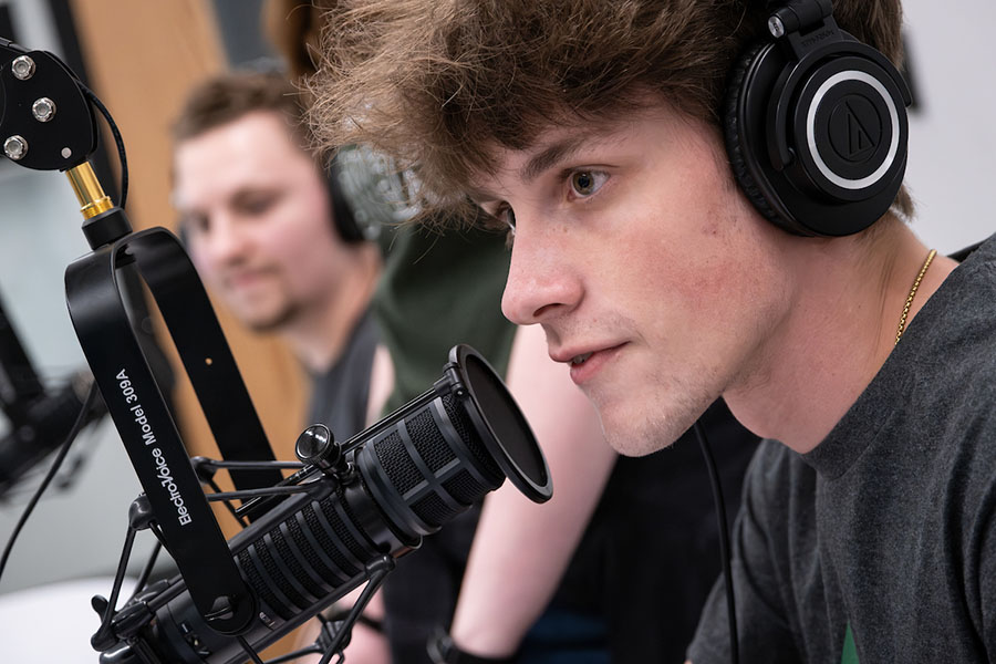 Radio production student with headphones
