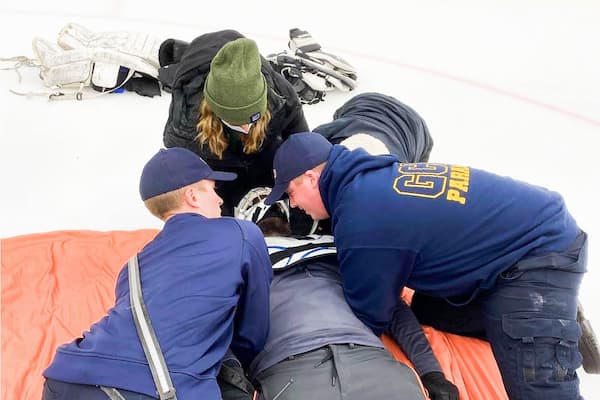 Students practice techniques on injured athlete