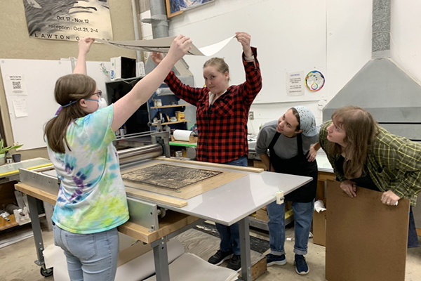 Four students in printmaking class