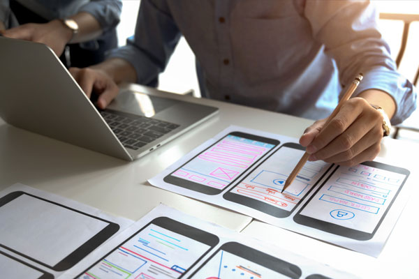 Employee works on mobile app wireframes