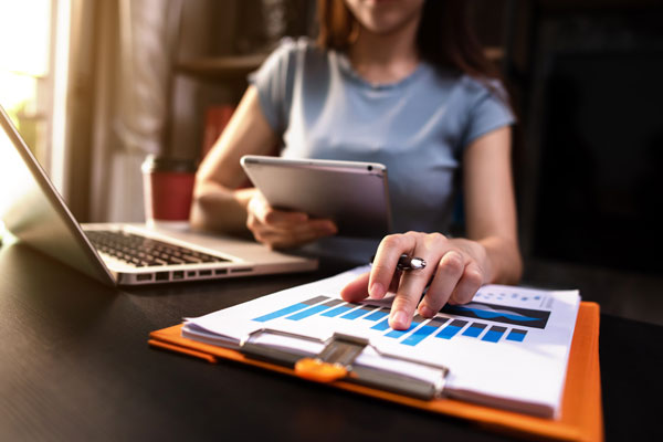 Female works on analytics at desk