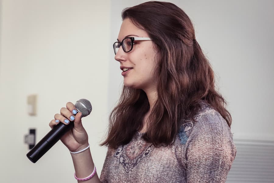 Female student gives speech after recieving a scholarship