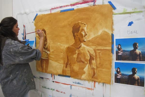 Student painting portraits