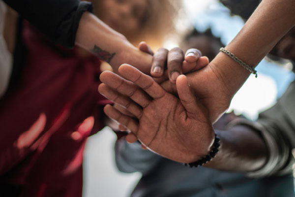 stacked hands unity concept