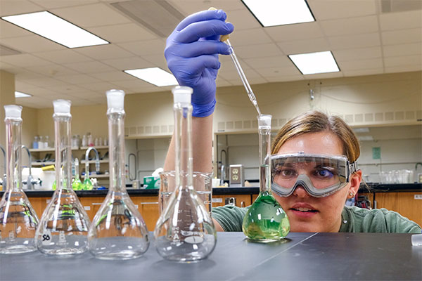 Student conducting research in lab
