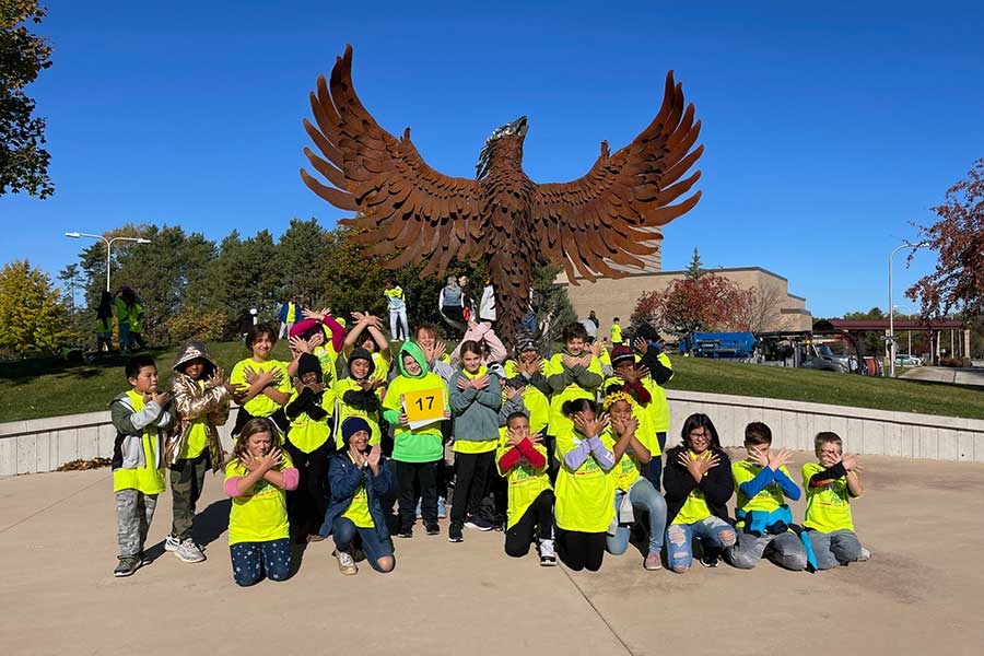 Group of Phuture Phoenix 5th graders in front of the Phoenix Sculpture