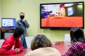 Group of students work on virtual reality game together