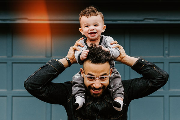 Father with son on shoulders