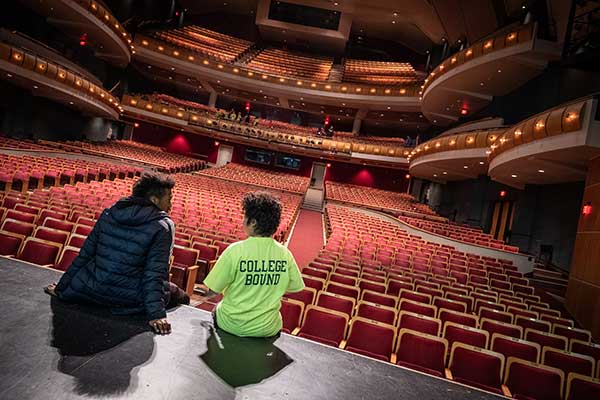 Mentor with student on stage