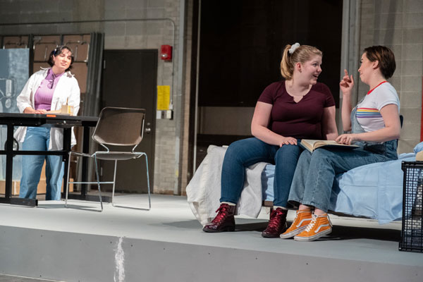 Three students rehearsing for Fun Home the Musical